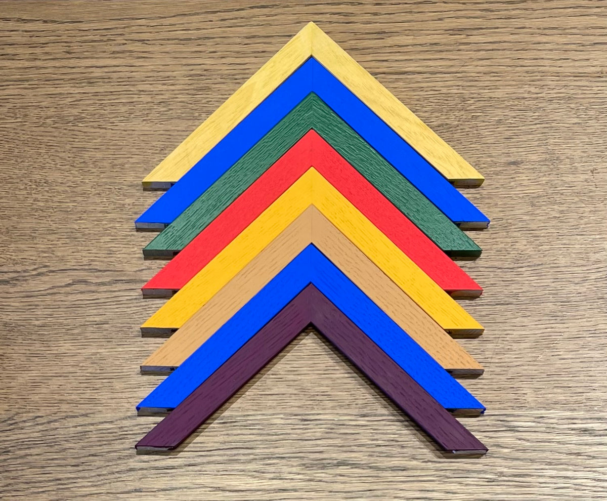Set of colorful wooden arrow-shaped blocks on a wooden surface